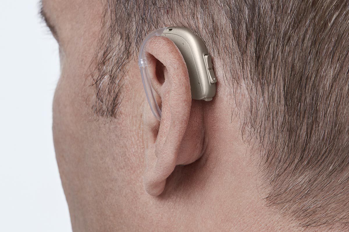 BTE - Behind the Ear Hearing Aid on a man