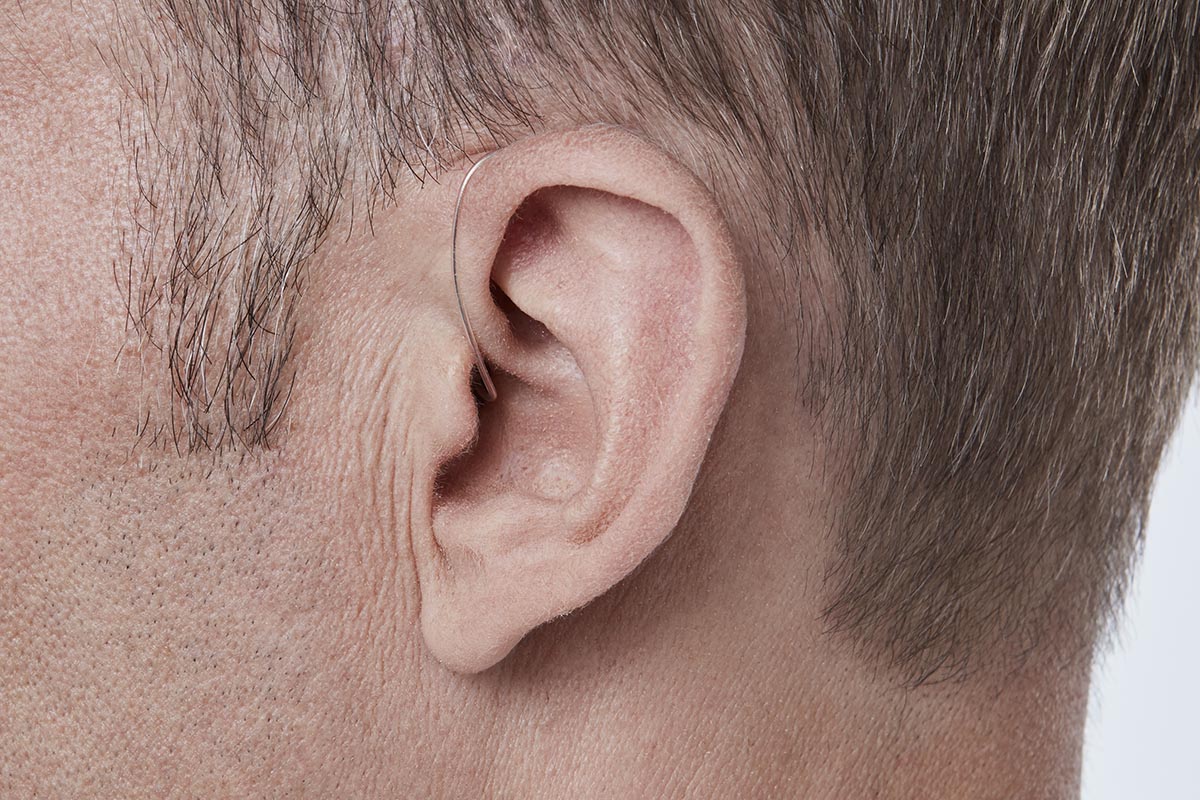 Receiver in the ear hearing aid on a mans ear