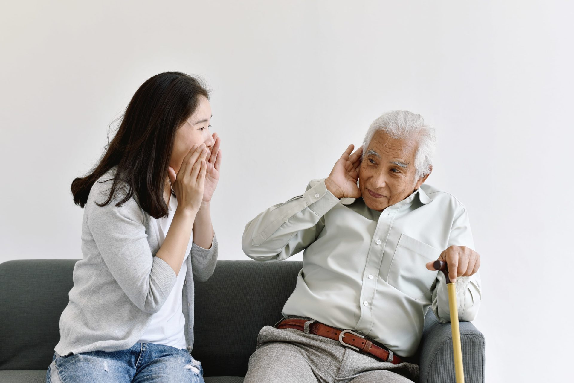 elderly man suffering from hearing loss
