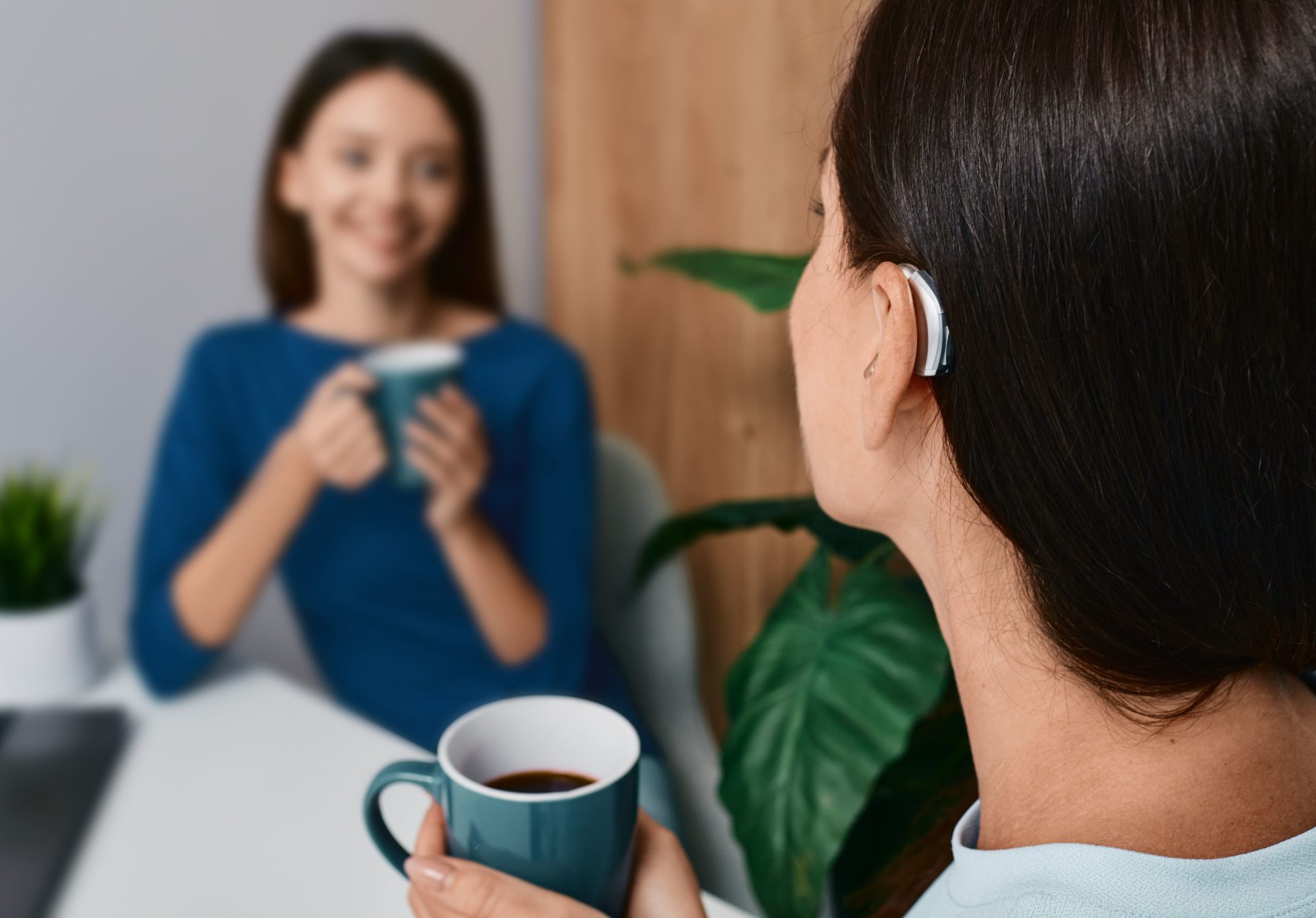 young woman hearing better with hearing aids