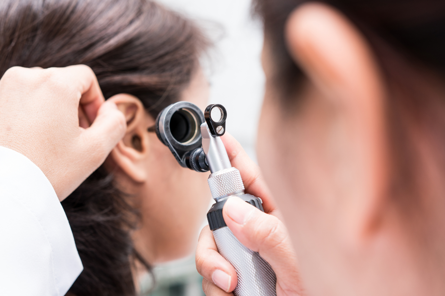 audiologist examining hearing loss