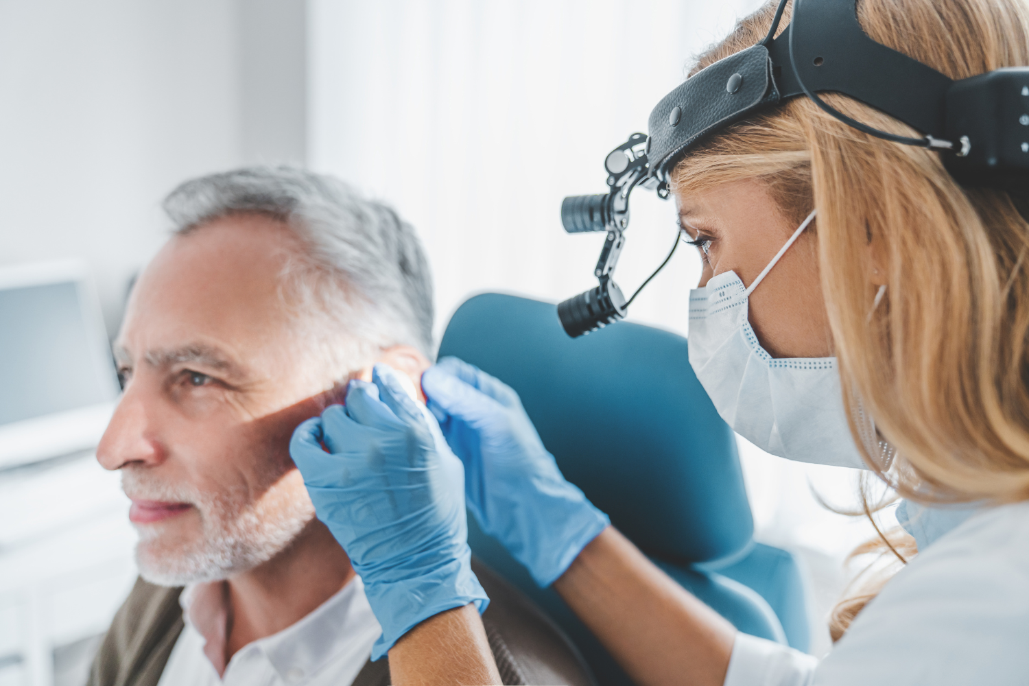 audiologist inspecting hearing loss